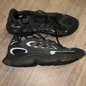 all-black Adidas Ozmillen sneakers featuring Adiplus cushioning